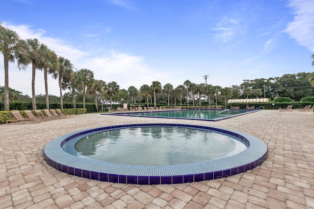 view of swimming pool featuring a patio