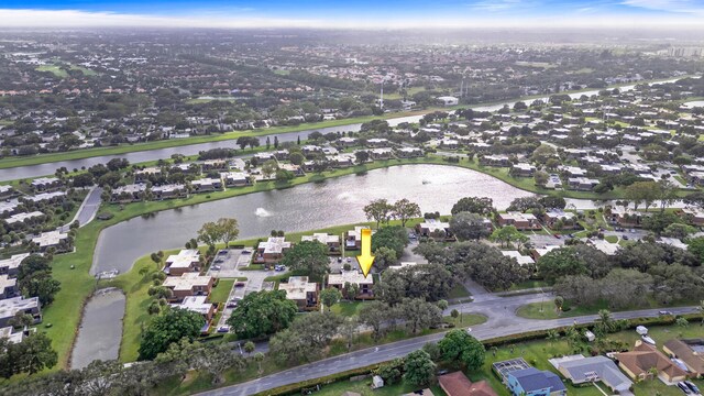 233 Charter Way, West Palm Beach, FL 33407 - aerial overview of property's location with nearby suburban area and a nearby body of water