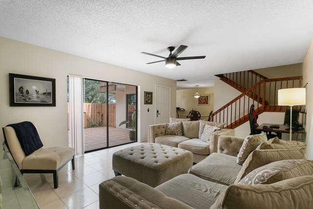 233 Charter Way, West Palm Beach, FL 33407 - living area featuring stairs, a ceiling fan, light tile patterned flooring, and a textured ceiling