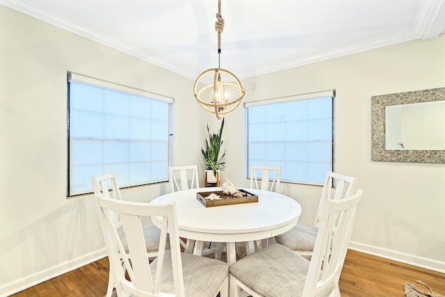 dining room featuring dark hardwood / wood-style floors and crown molding