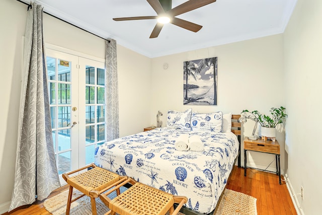 bedroom with access to outside, french doors, ornamental molding, hardwood / wood-style flooring, and ceiling fan