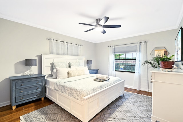 bedroom featuring ceiling fan, dark hardwood / wood-style floors, and ornamental molding