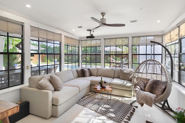 sunroom / solarium with ceiling fan