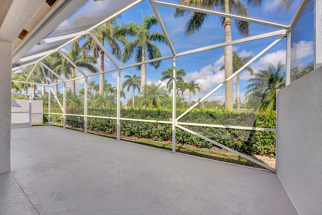 view of patio / terrace featuring a lanai