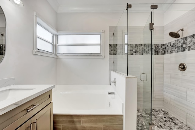 bathroom featuring vanity, a healthy amount of sunlight, separate shower and tub, and crown molding