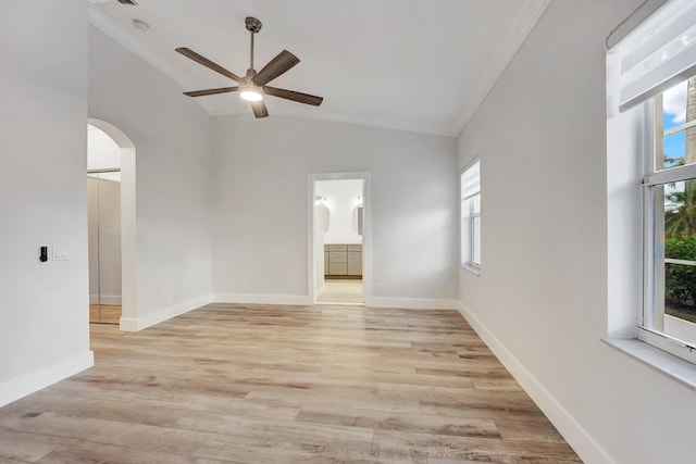 unfurnished room with light hardwood / wood-style flooring, lofted ceiling, and a healthy amount of sunlight