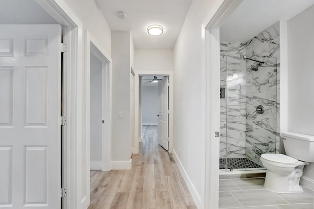 corridor with light hardwood / wood-style flooring