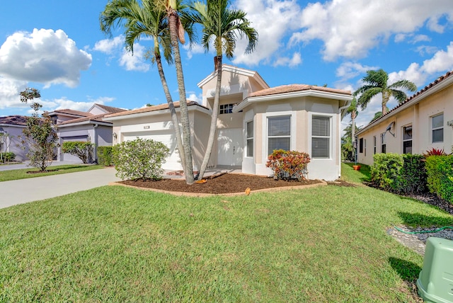 mediterranean / spanish-style house featuring a garage and a front lawn