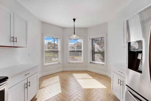 dining space with light parquet flooring