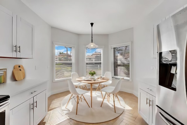 dining space with light parquet floors