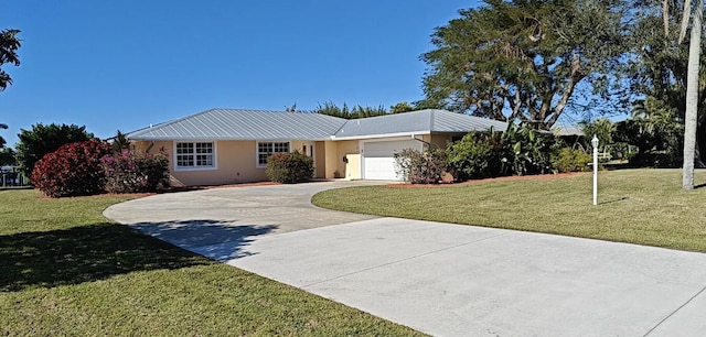 ranch-style house with a garage and a front lawn