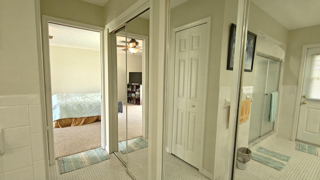 hall featuring light colored carpet