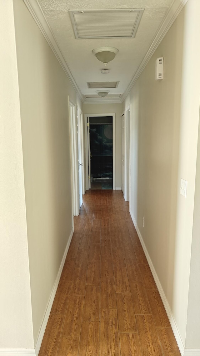 hall featuring wood-type flooring and ornamental molding