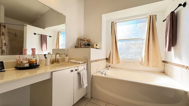 bathroom with tile patterned floors, vanity, separate shower and tub, and vaulted ceiling