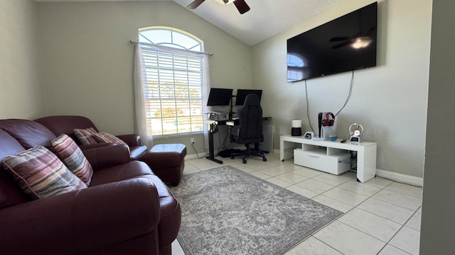 tiled office space featuring vaulted ceiling and ceiling fan