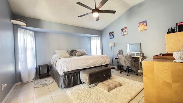 bedroom with ceiling fan, light tile patterned floors, a textured ceiling, and high vaulted ceiling