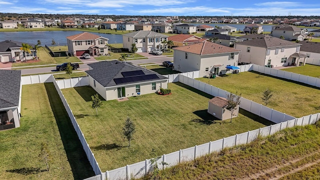 aerial view with a water view and a residential view