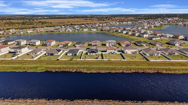 aerial view featuring a water view and a residential view