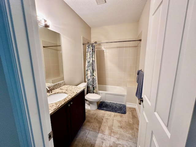 full bathroom with vanity, a textured ceiling, toilet, and shower / bath combo with shower curtain