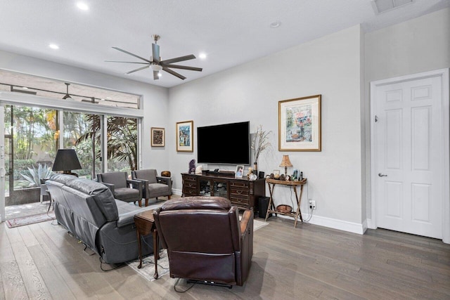 living room featuring ceiling fan and wood-type flooring