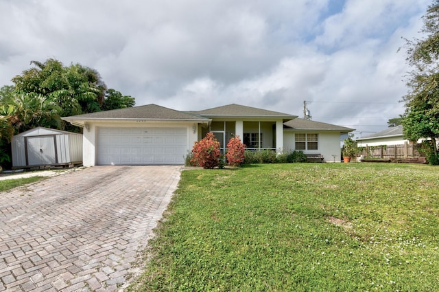 ranch-style house with a garage and a front yard