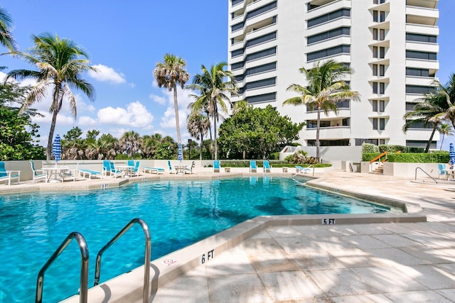 view of swimming pool with a patio