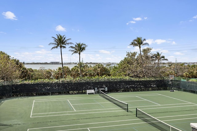 view of sport court featuring a water view