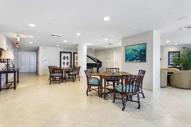 dining area featuring light tile patterned floors