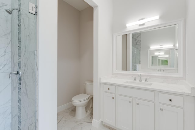 bathroom featuring an enclosed shower, vanity, and toilet