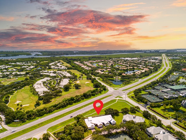 aerial view at dusk with a water view