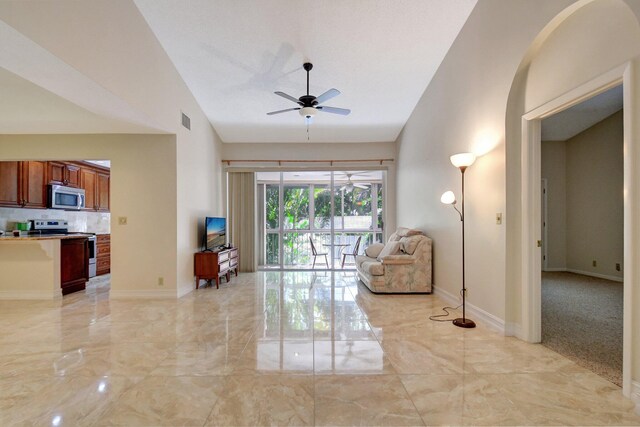 unfurnished sunroom featuring plenty of natural light and ceiling fan