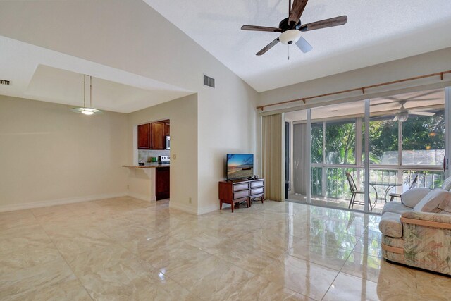 interior space with high vaulted ceiling and ceiling fan