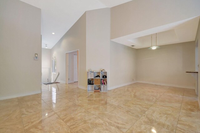 unfurnished room with ceiling fan and vaulted ceiling