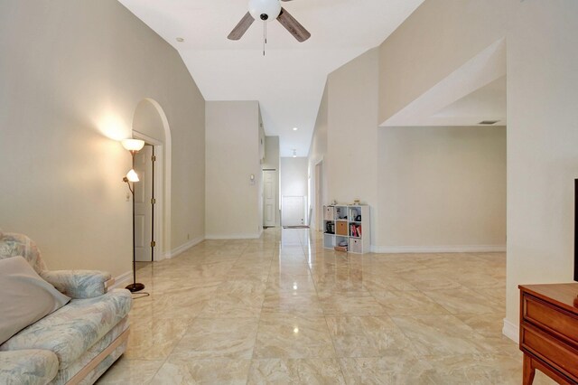 sitting room featuring ceiling fan and lofted ceiling