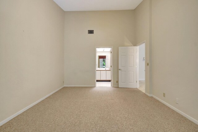 bathroom featuring toilet, vanity, tile patterned floors, and walk in shower