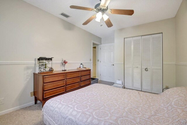 bathroom with a textured ceiling, vanity, toilet, and walk in shower