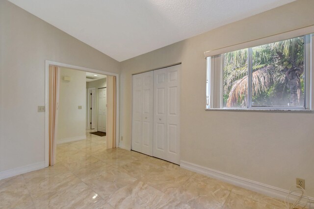 bedroom featuring ceiling fan, light colored carpet, and a textured ceiling