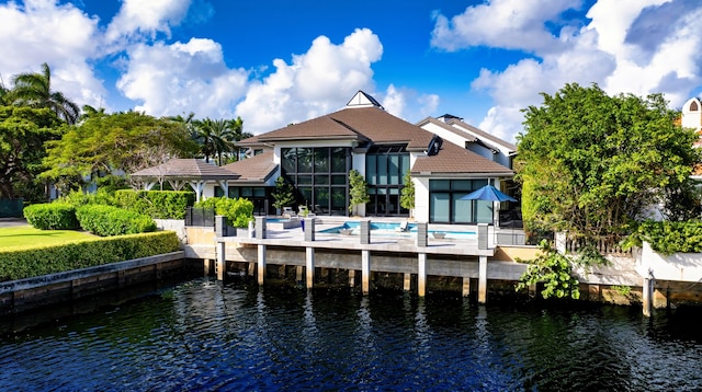 rear view of house with a water view