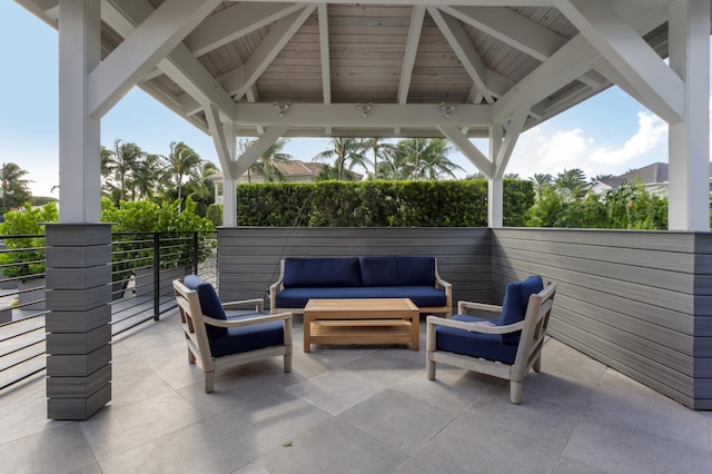 view of patio with an outdoor living space and a gazebo