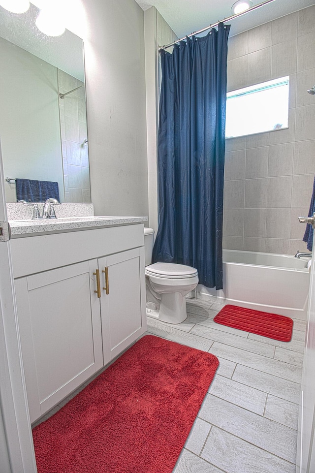 full bathroom featuring vanity, toilet, and shower / bath combo