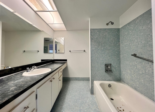 bathroom with tile patterned floors, shower / tub combination, vanity, and baseboards