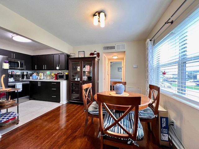 dining room featuring light hardwood / wood-style floors