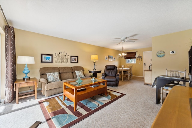 living room featuring ceiling fan with notable chandelier and light colored carpet