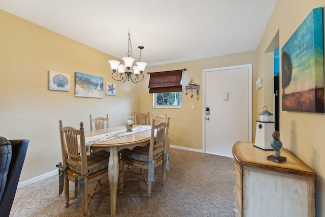 carpeted dining space with a textured ceiling and an inviting chandelier