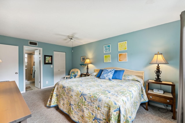 carpeted bedroom with connected bathroom, ceiling fan, and a closet