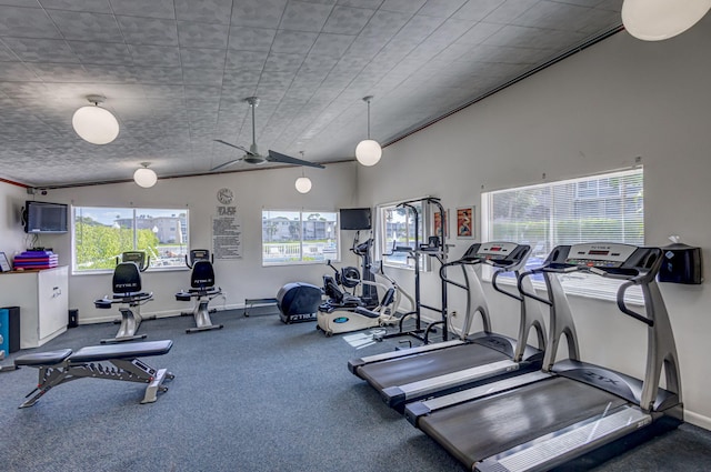 gym with ceiling fan and carpet floors