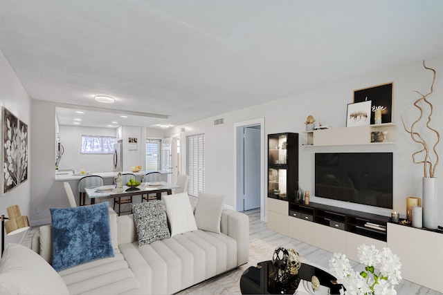 living room with light hardwood / wood-style floors