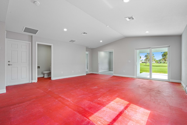 unfurnished room with carpet and vaulted ceiling