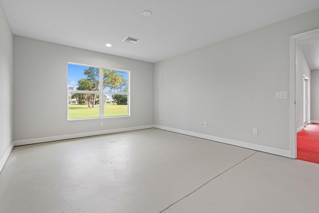 empty room with concrete flooring