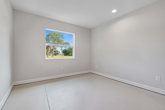 empty room with concrete flooring